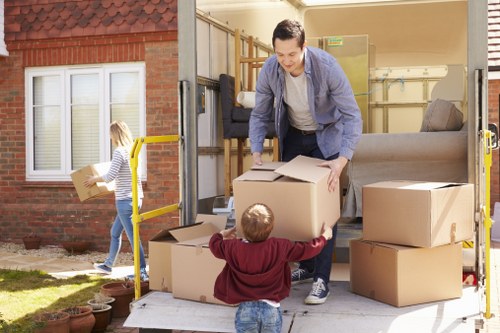 Furniture removals team working in an Islington residential street