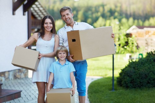 Moving team loading household items for a residential relocation in Islington