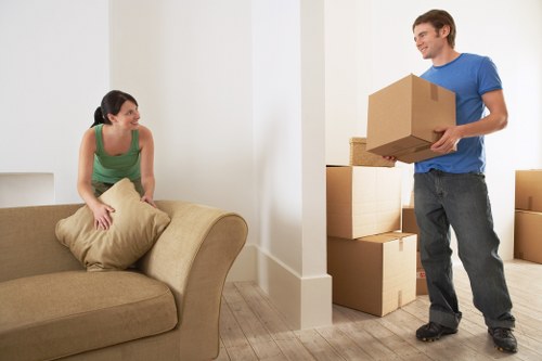 Packed boxes and protected furniture inside a local Islington home